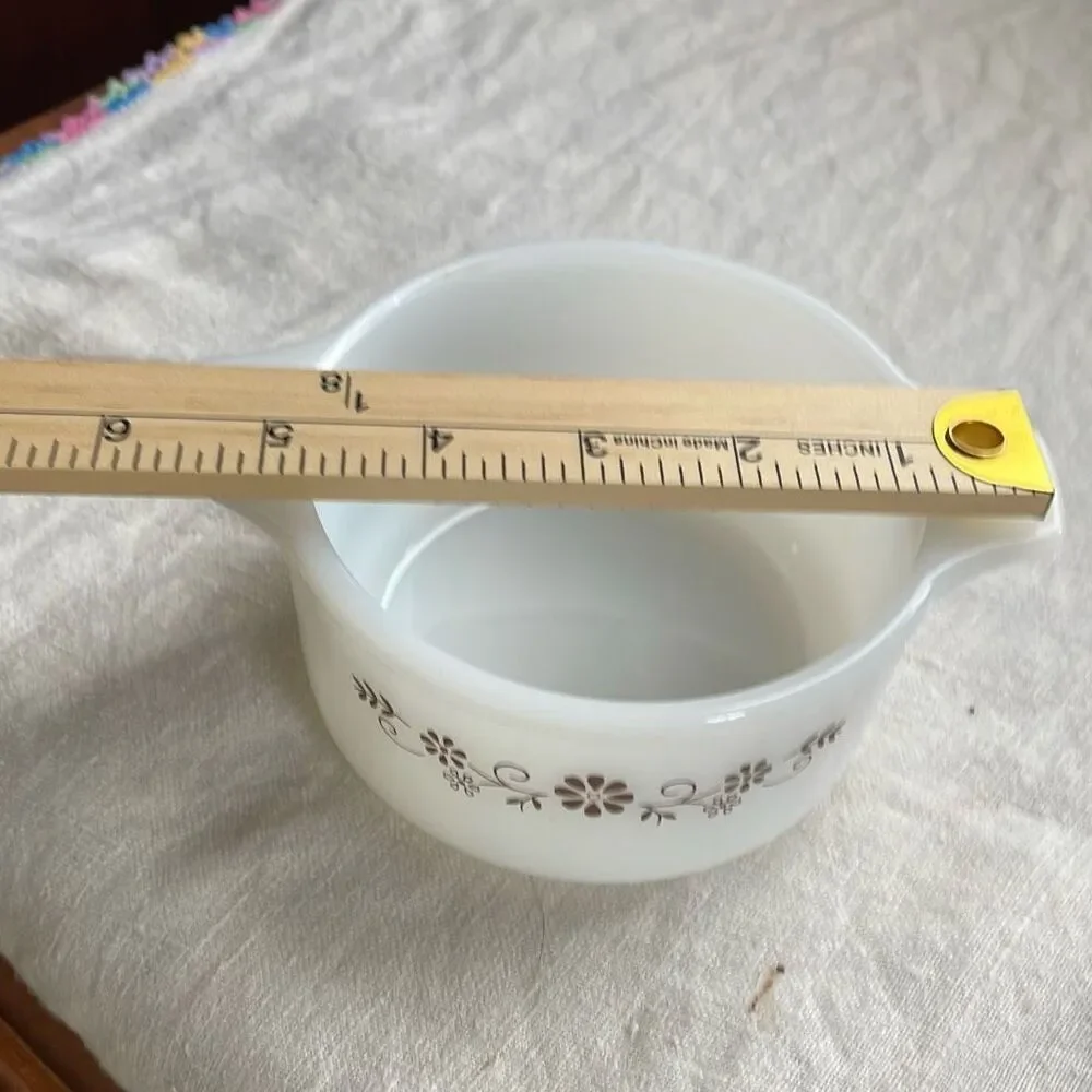 Vintage brown Daisy Dynaware Pyr-O-Rey casserole dish.